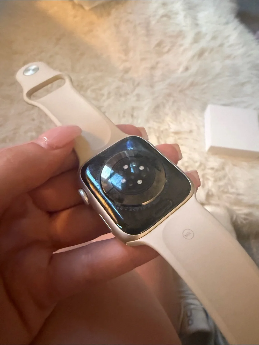 Silver Apple Watch with Light Gray Silicone Band